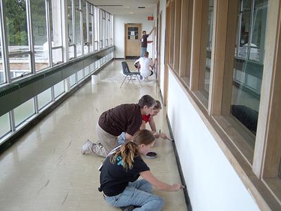 Sr. Margaret working with Ryan and another volunteer by FinanceProfessor.